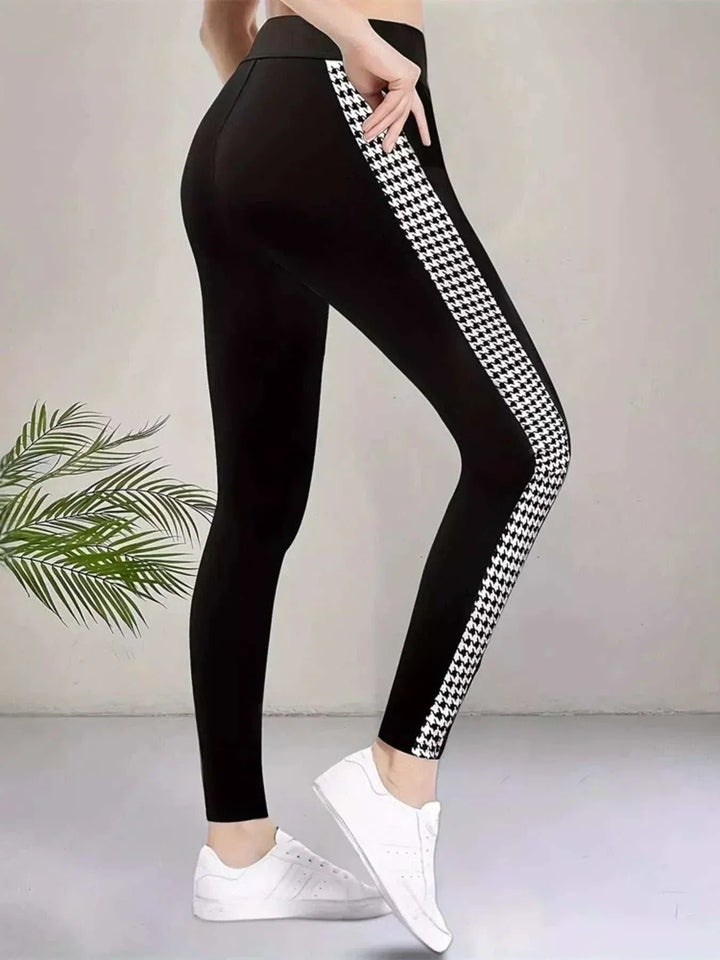 Women’s Houndstooth Leggings in black stretch fabric with bold black-and-white houndstooth side stripes and a high waist
