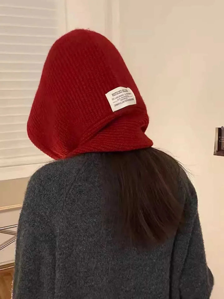Women’s knitted hat with attached scarf winter accessory from Hot Topic Goods