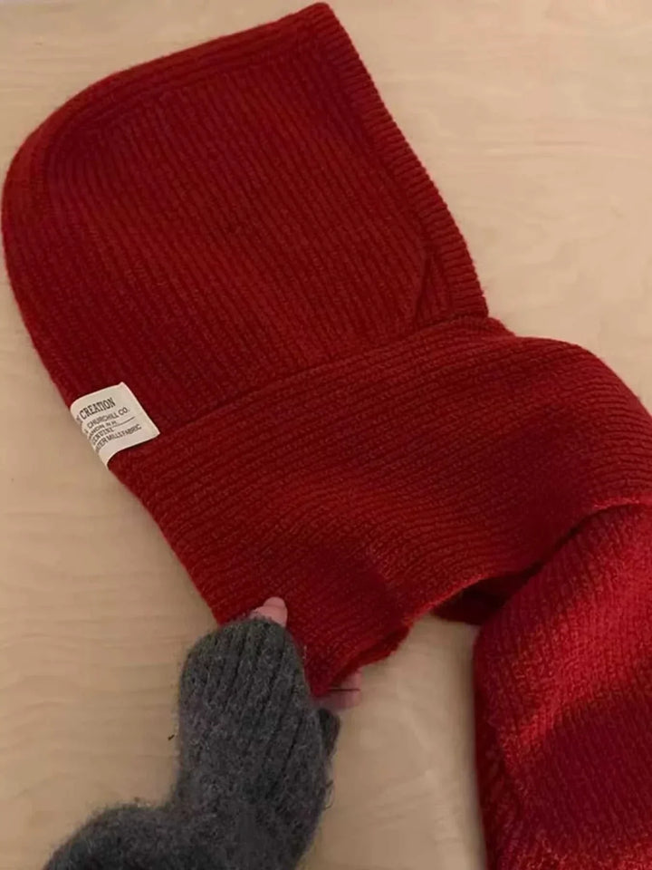 Women’s knitted hat with attached scarf in cozy winter style from Hot Topic Goods