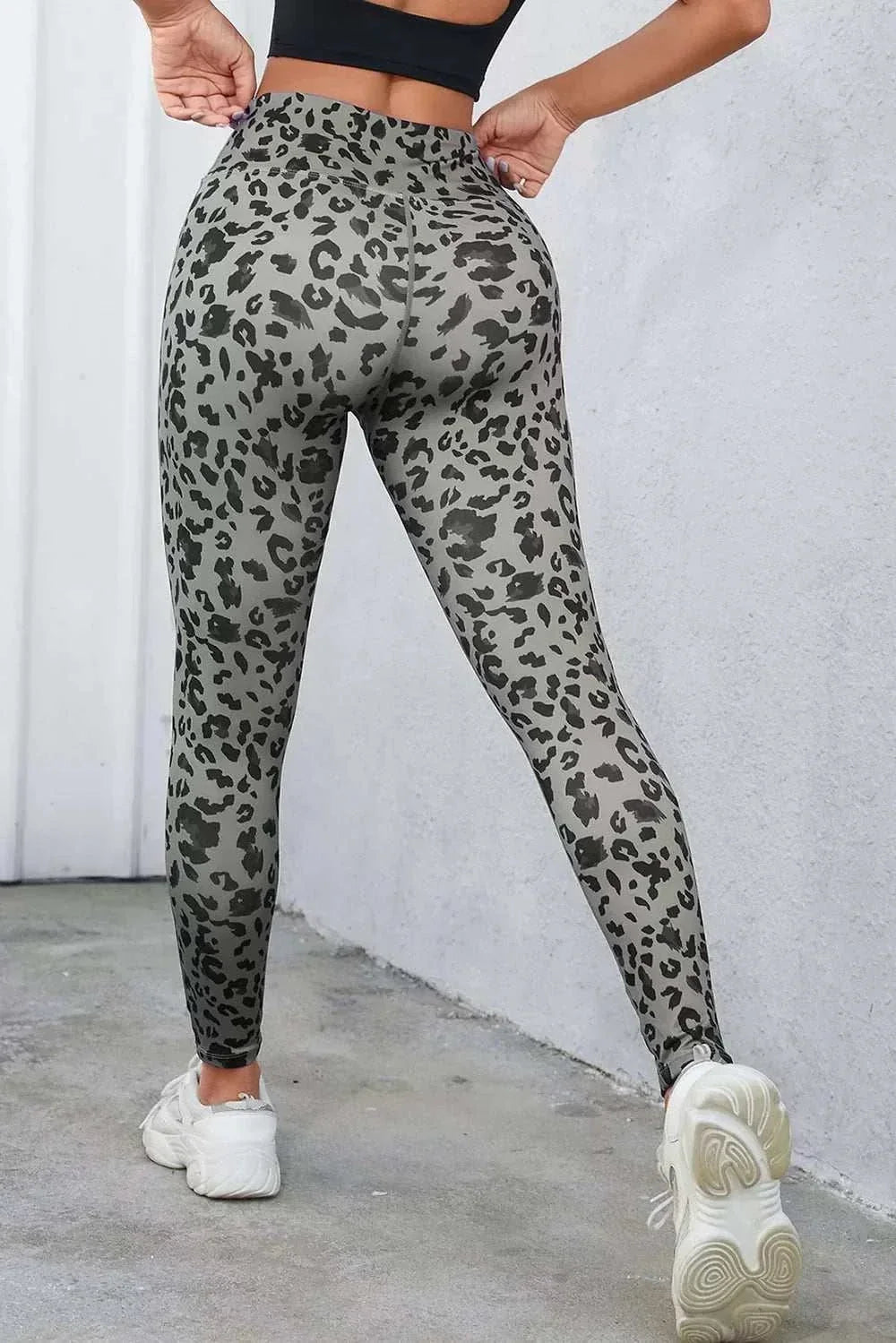 Women's leopard print leggings with wide waistband and fitted silhouette from Hot Topic Goods