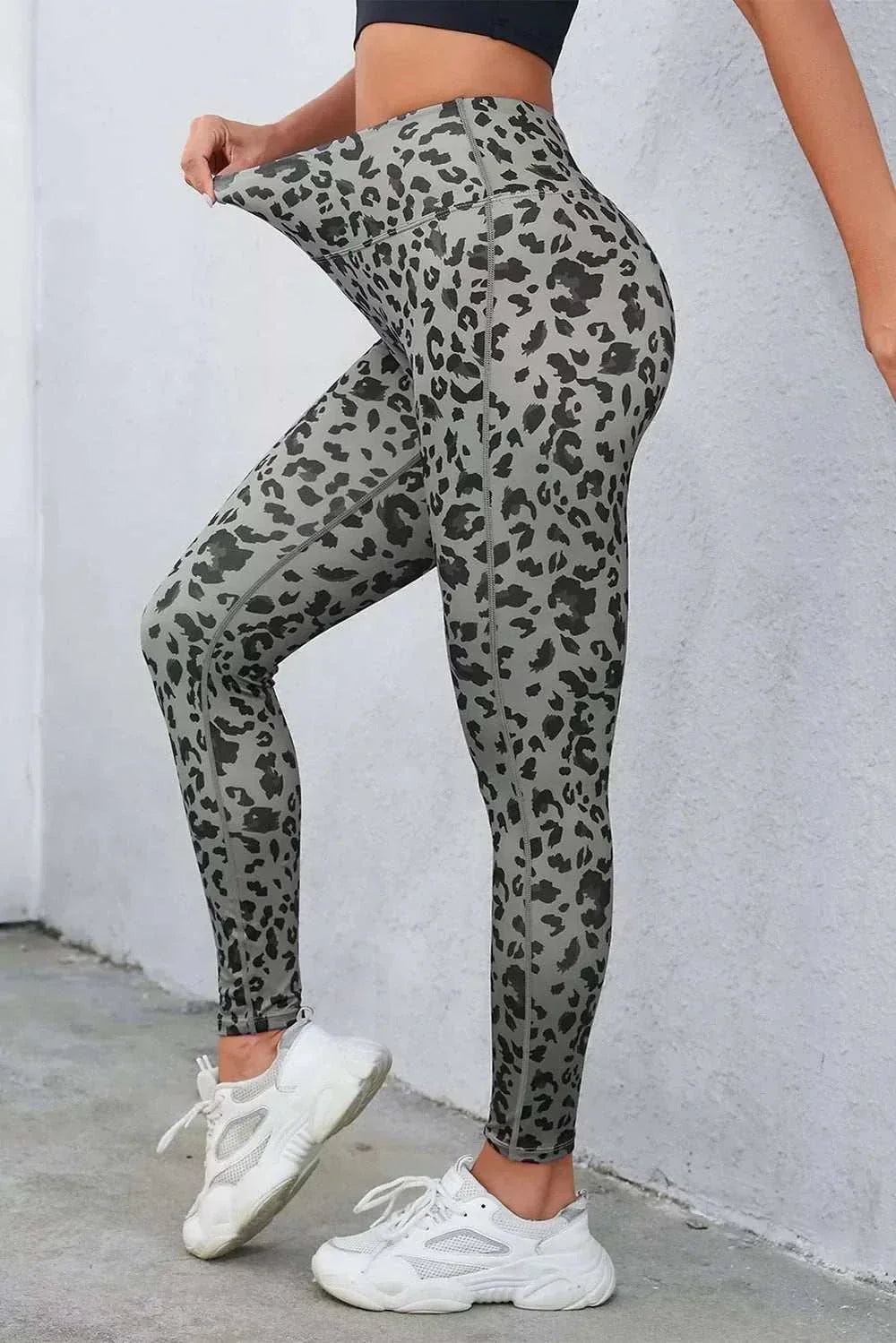 Women's leopard print leggings with wide waistband and fitted silhouette from Hot Topic Goods