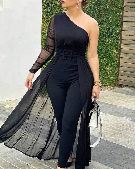 Woman wearing a long sleeve mesh patchwork jumpsuit with slim fit and round neckline from Hot Topic Goods