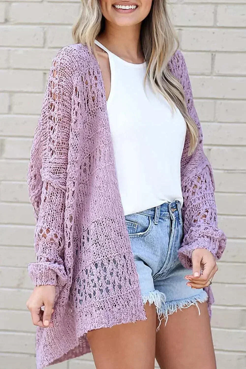 Women wearing a lightweight open-front long sleeve cardigan with textured openwork design from Hot Topic Goods.