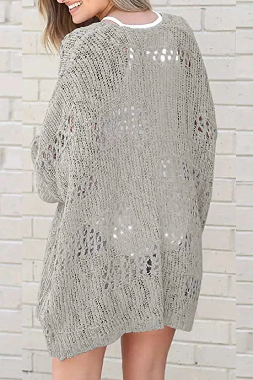 Women wearing lightweight open-front long sleeve cardigan with openwork texture by Hot Topic Goods