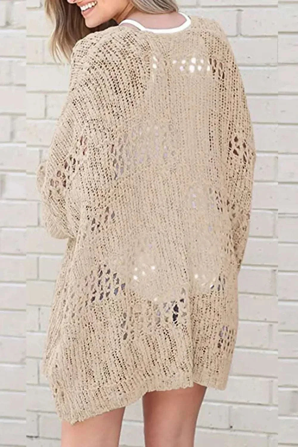 Women wearing lightweight open-front long sleeve cardigan with openwork texture by Hot Topic Goods