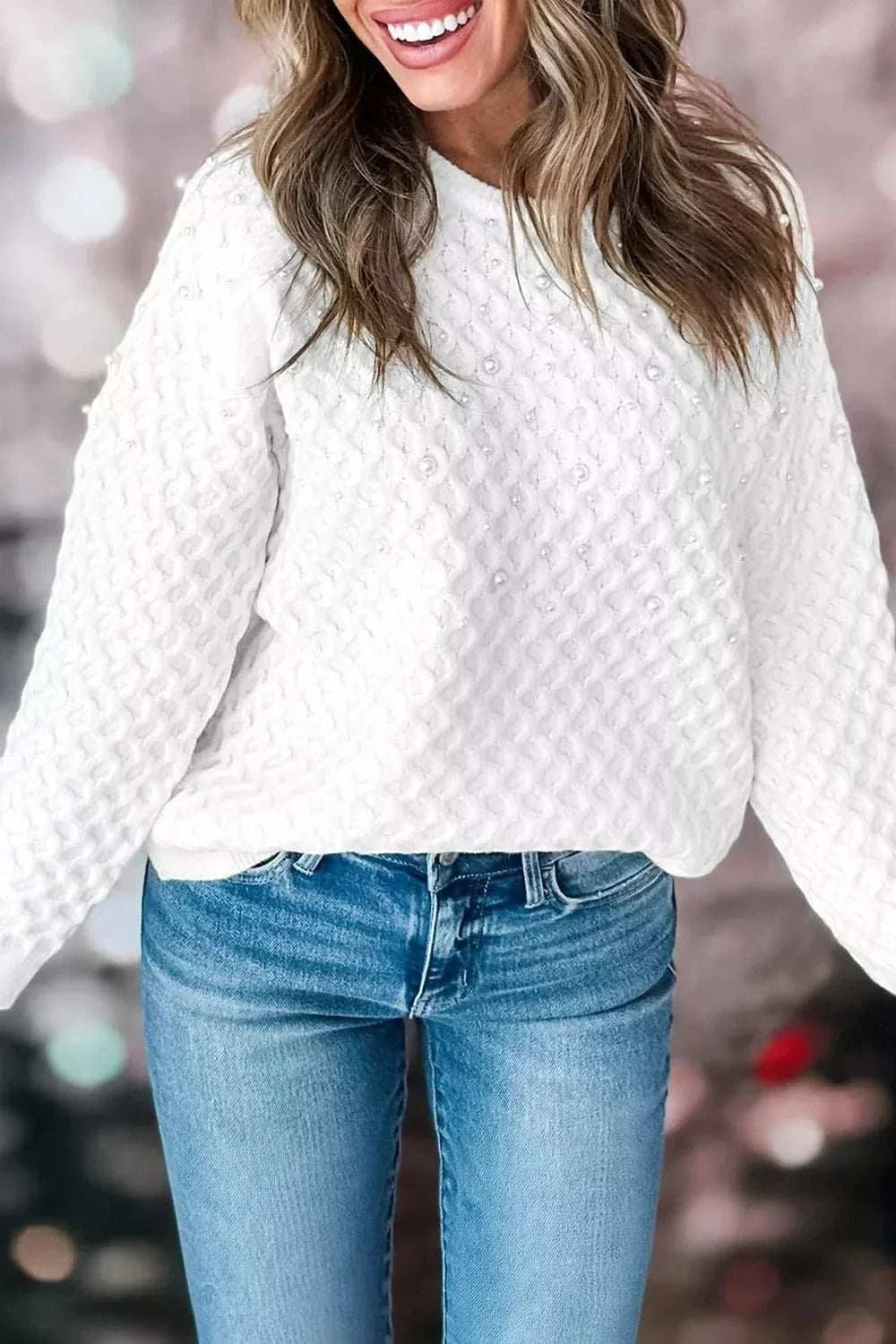 Women’s pearl embellished textured knit sweater with long sleeves from Hot Topic Goods