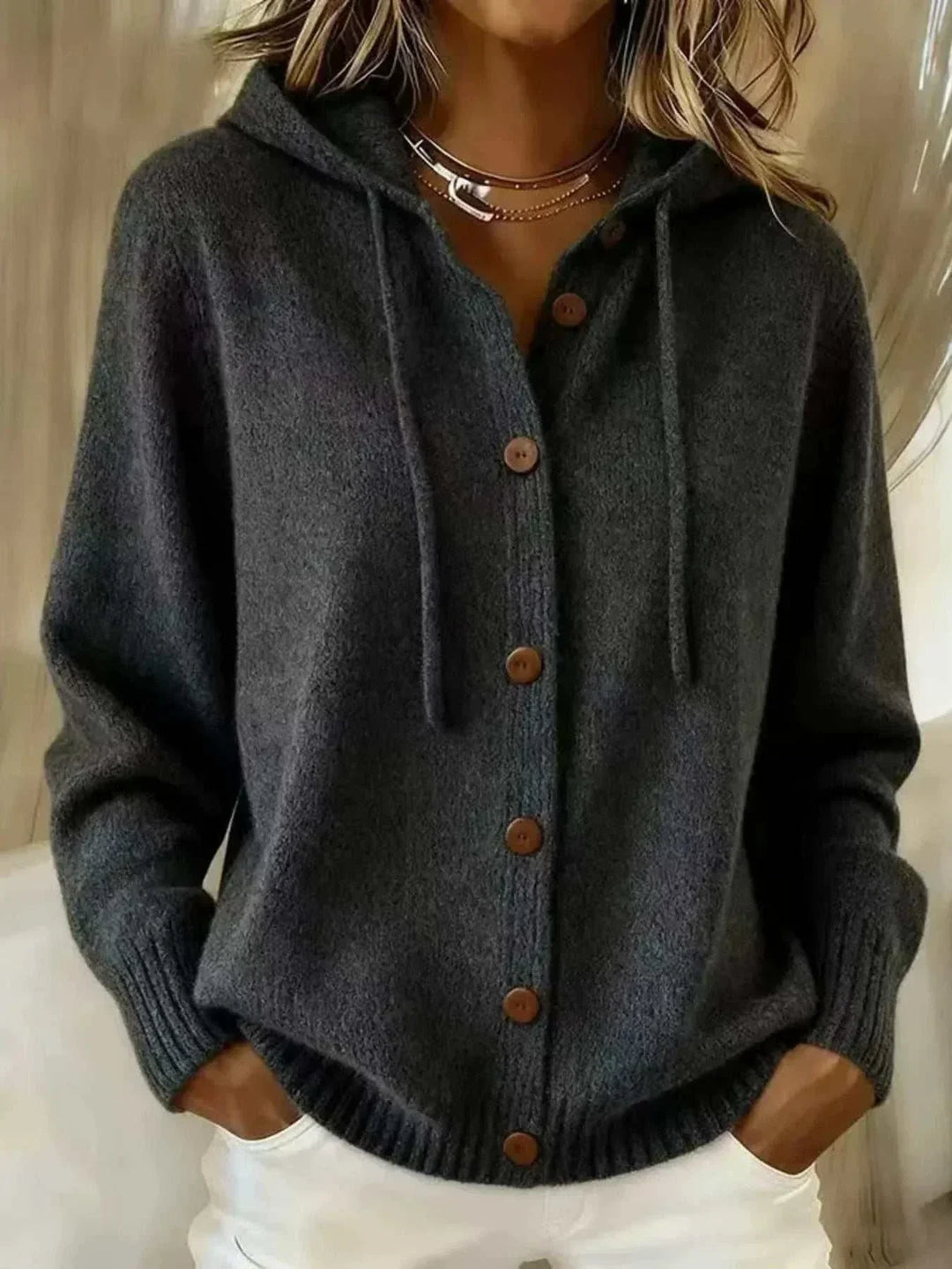 Women’s plus size hooded cardigan sweater with button-down front and knit construction from Hot Topic Goods