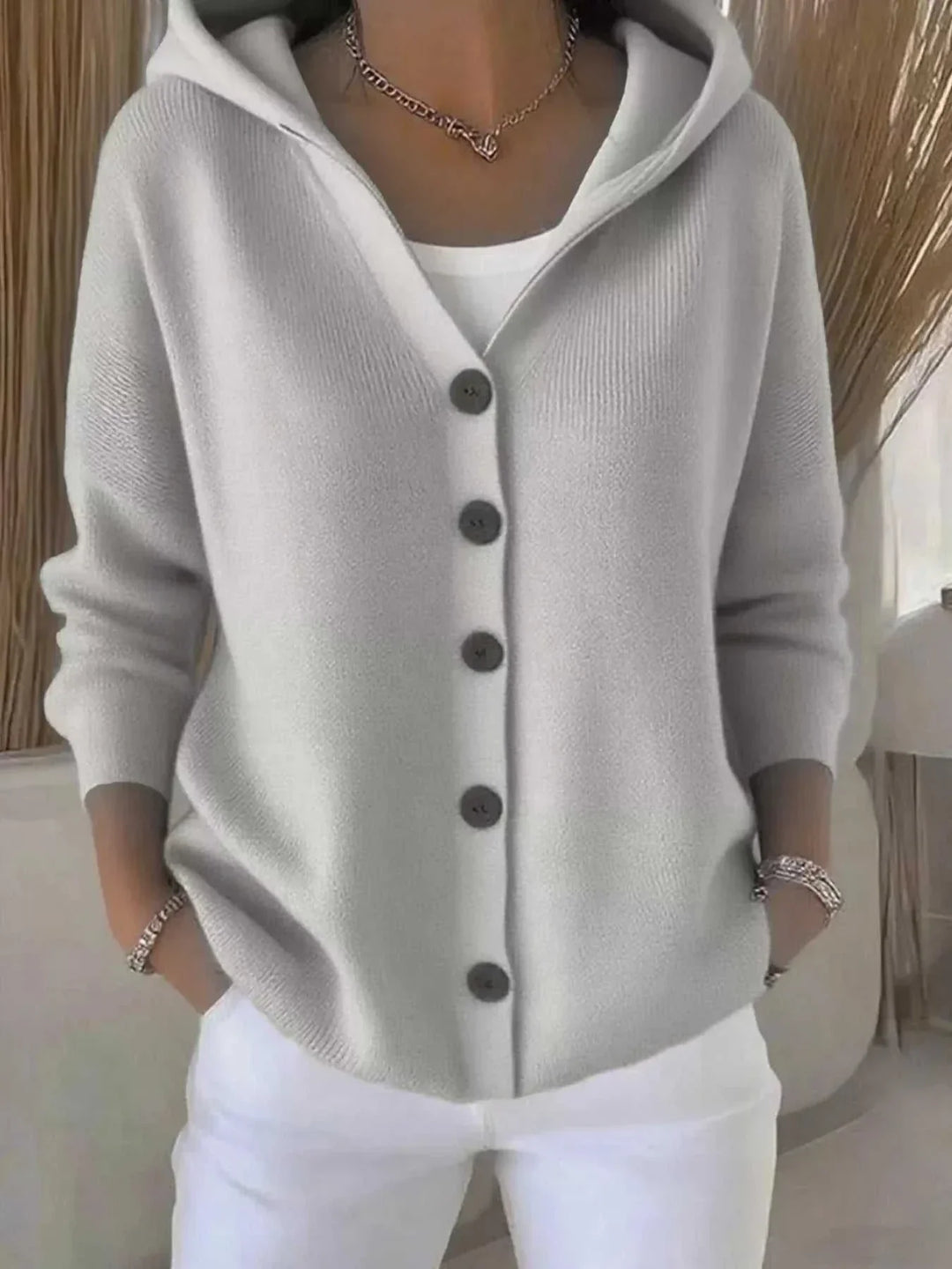 Women’s plus size long sleeve cardigan with button front and hood from Hot Topic Goods in soft knit fabric