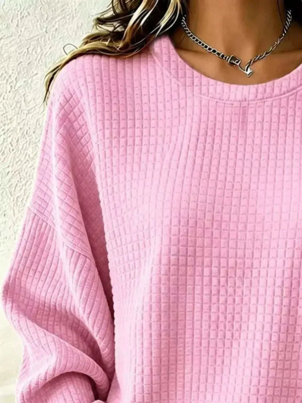 Women's Plus Size Waffle Knit Sweatshirt in pink textured knit, with a wide crew neckline and long sleeves