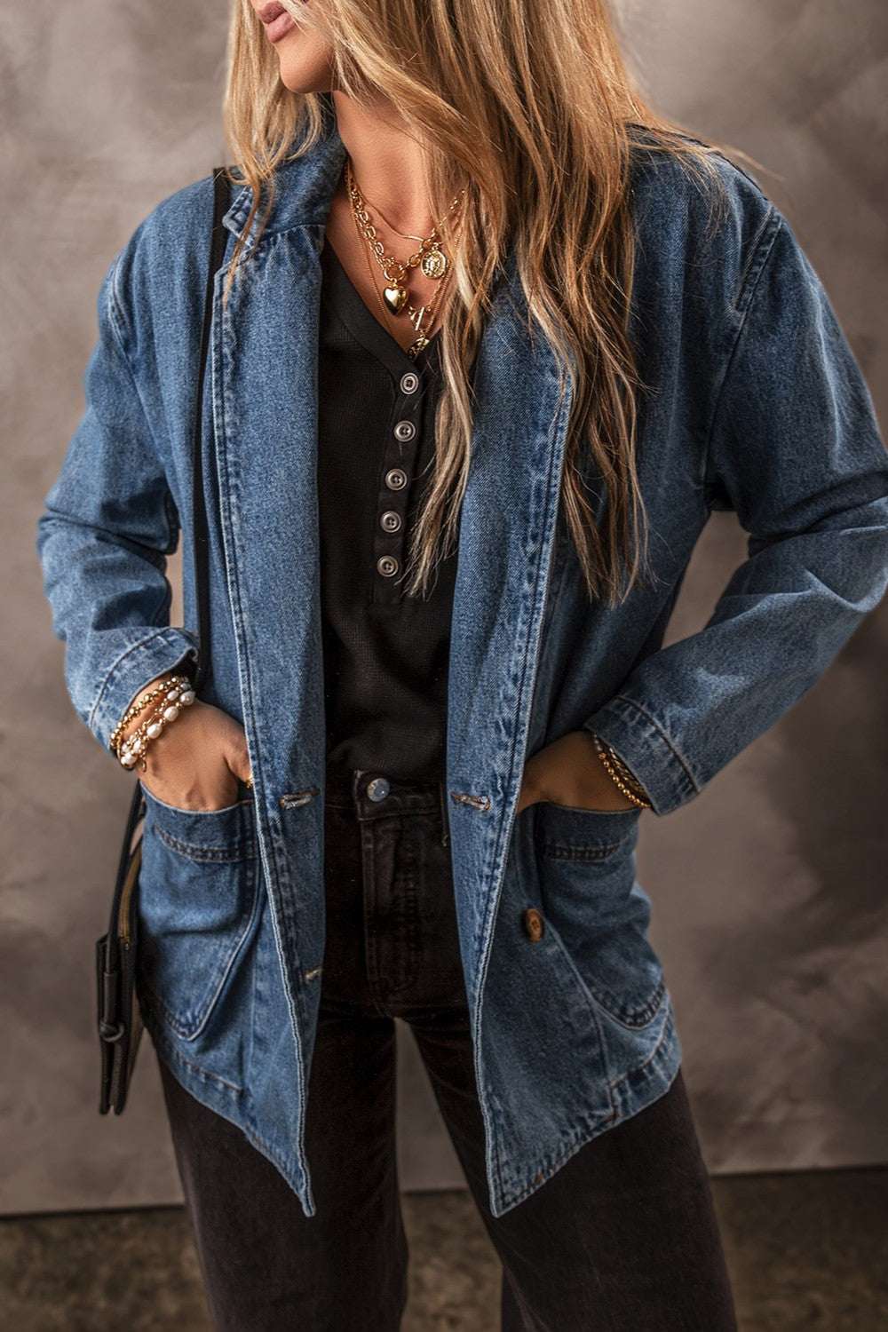 Women's pocketed long sleeve denim jacket with button closure and functional pockets