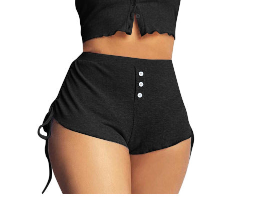 Black drawstring shorts with button details and adjustable waist for comfort and style.