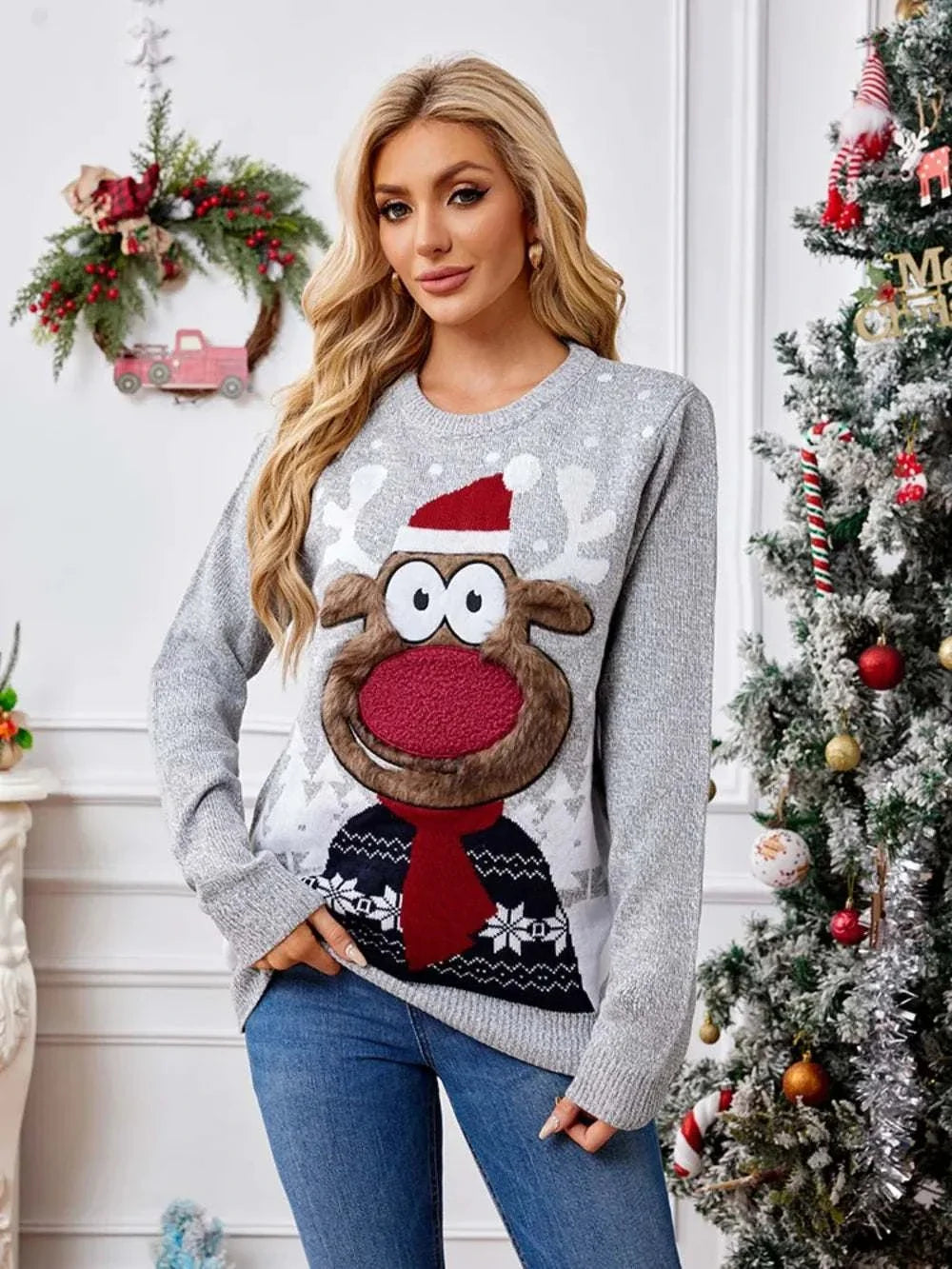 Women's reindeer print sweater with round neckline and long sleeves from Hot Topic Goods