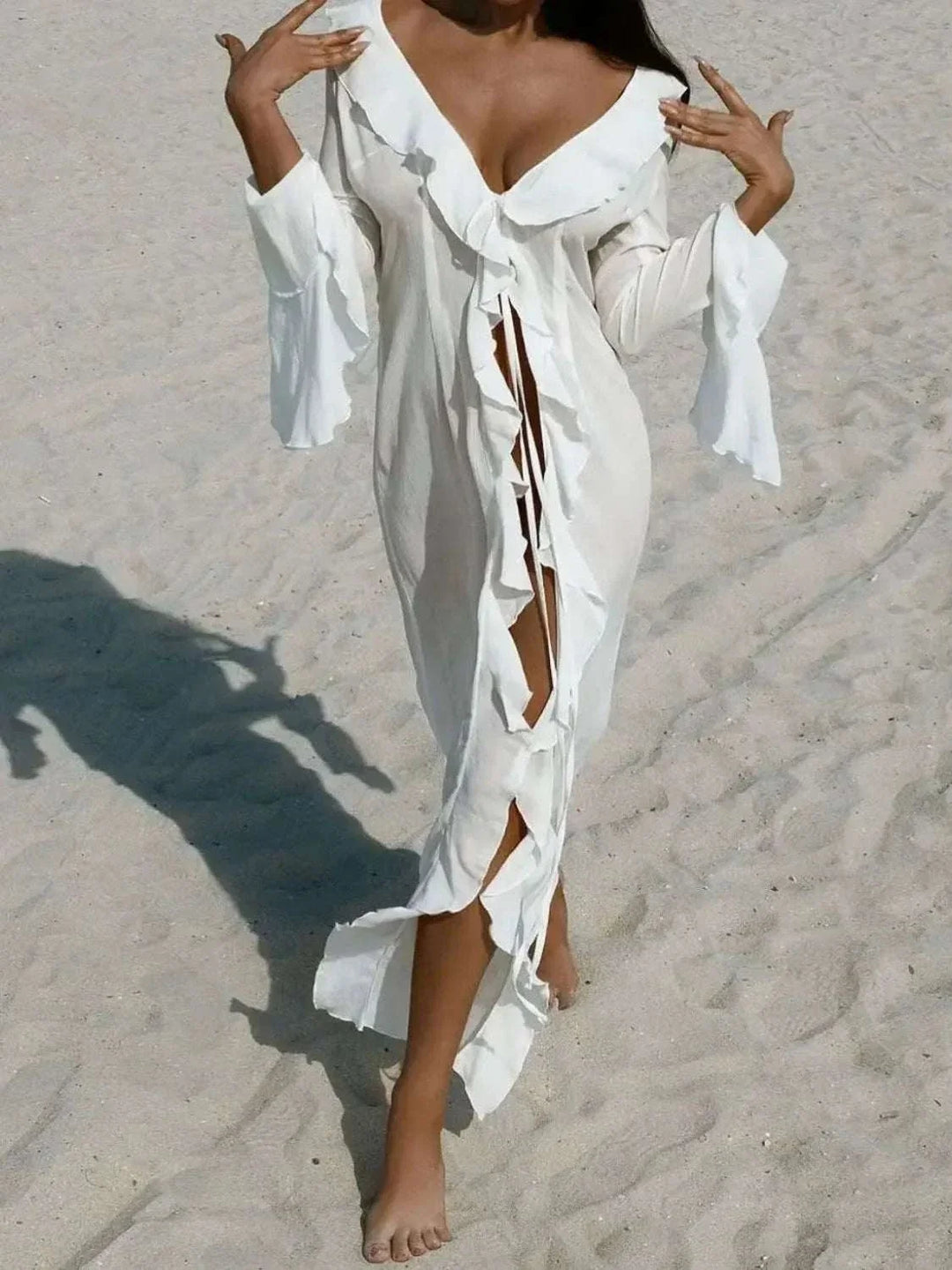 Woman wearing a Women's Ruffled Cover-Up Dress with long sleeves and feminine ruffle detailing at the beach