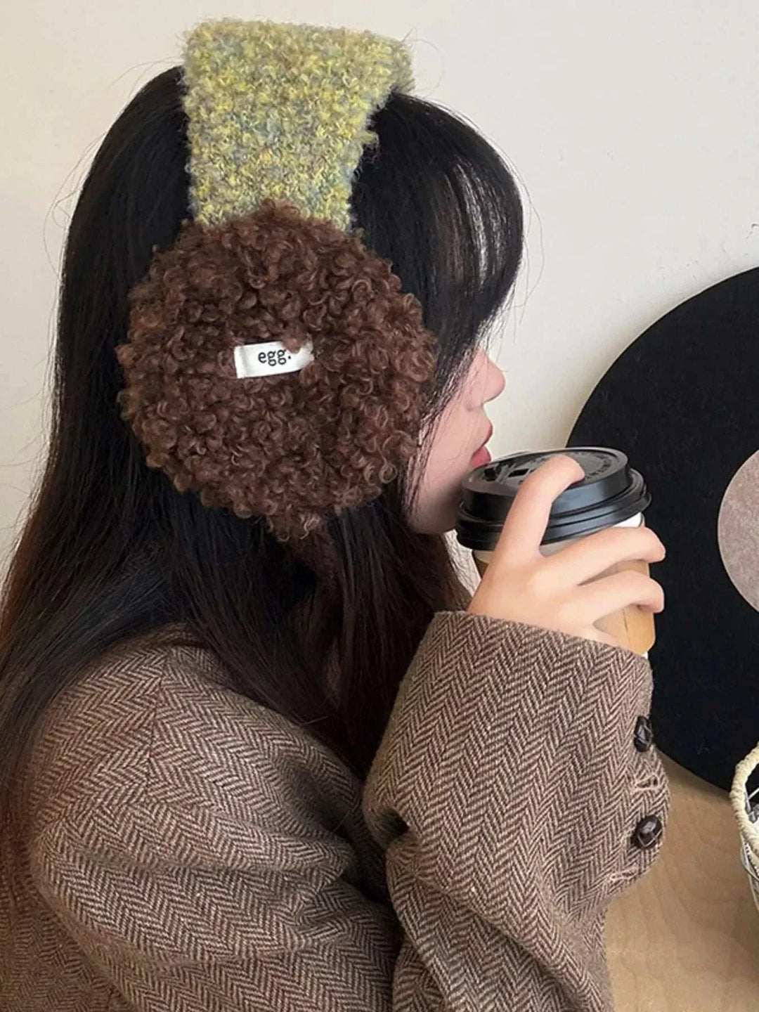 Women's Sherpa earmuffs with plush sherpa texture, cozy ear coverage, and classic design from Hot Topic Goods for fall and winter.