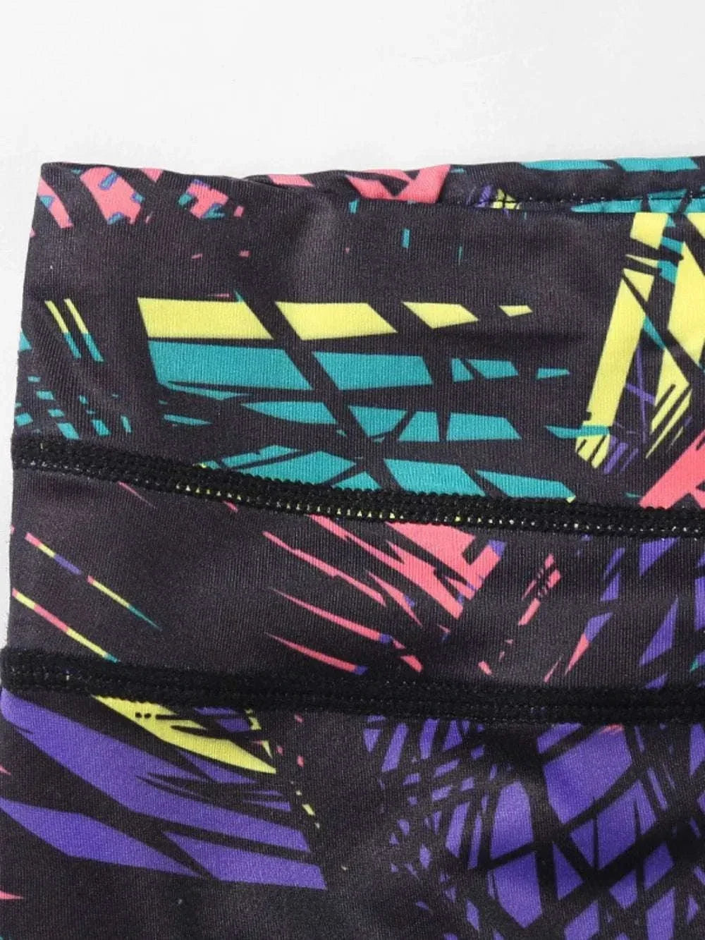 Women’s Stirrup Active Leggings with printed design and wide waistband from Hot Topic Goods