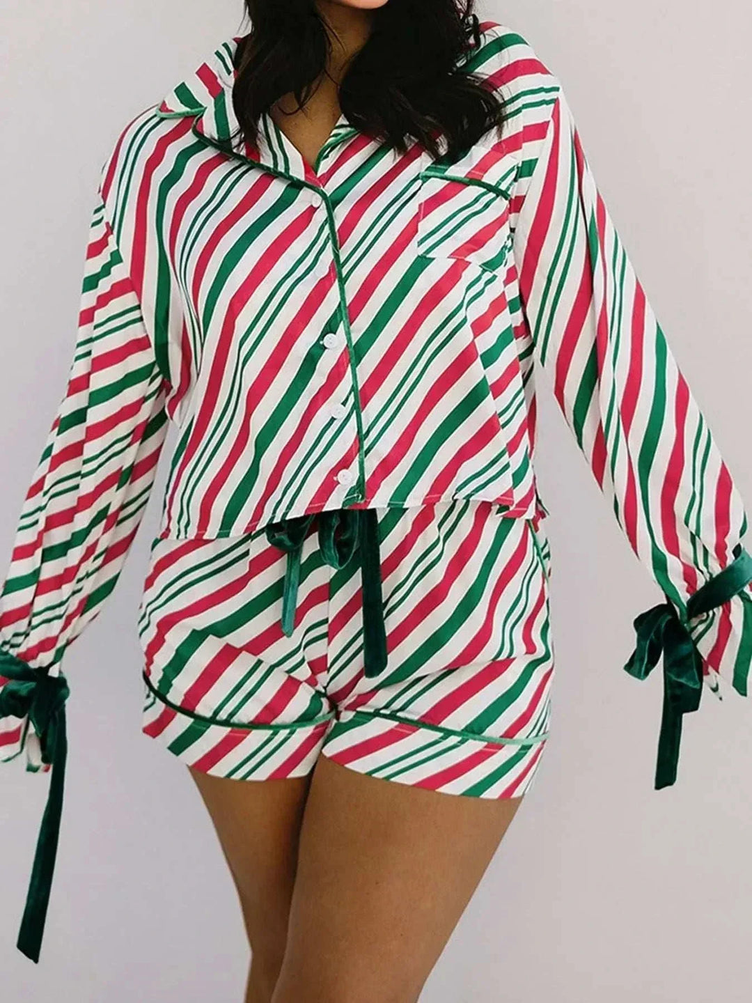 Women's stripe contrast velvet bow pajama set with festive holiday design and cozy fit