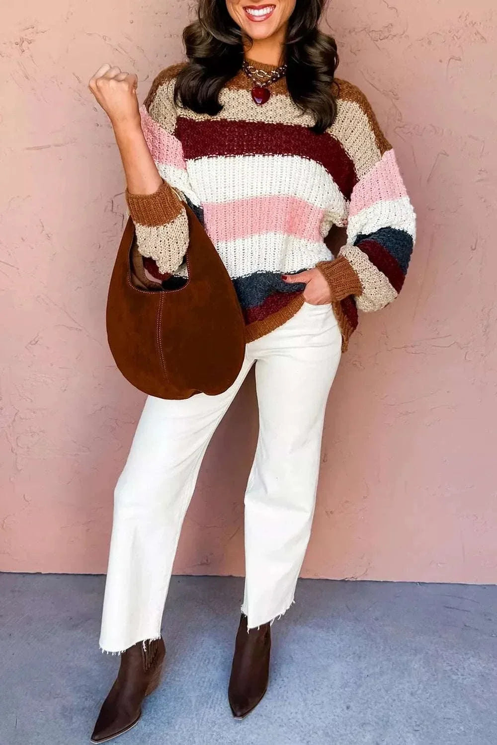 Woman wearing Women’s Striped Knit Sweater with dropped shoulders and round neckline from Hot Topic Goods