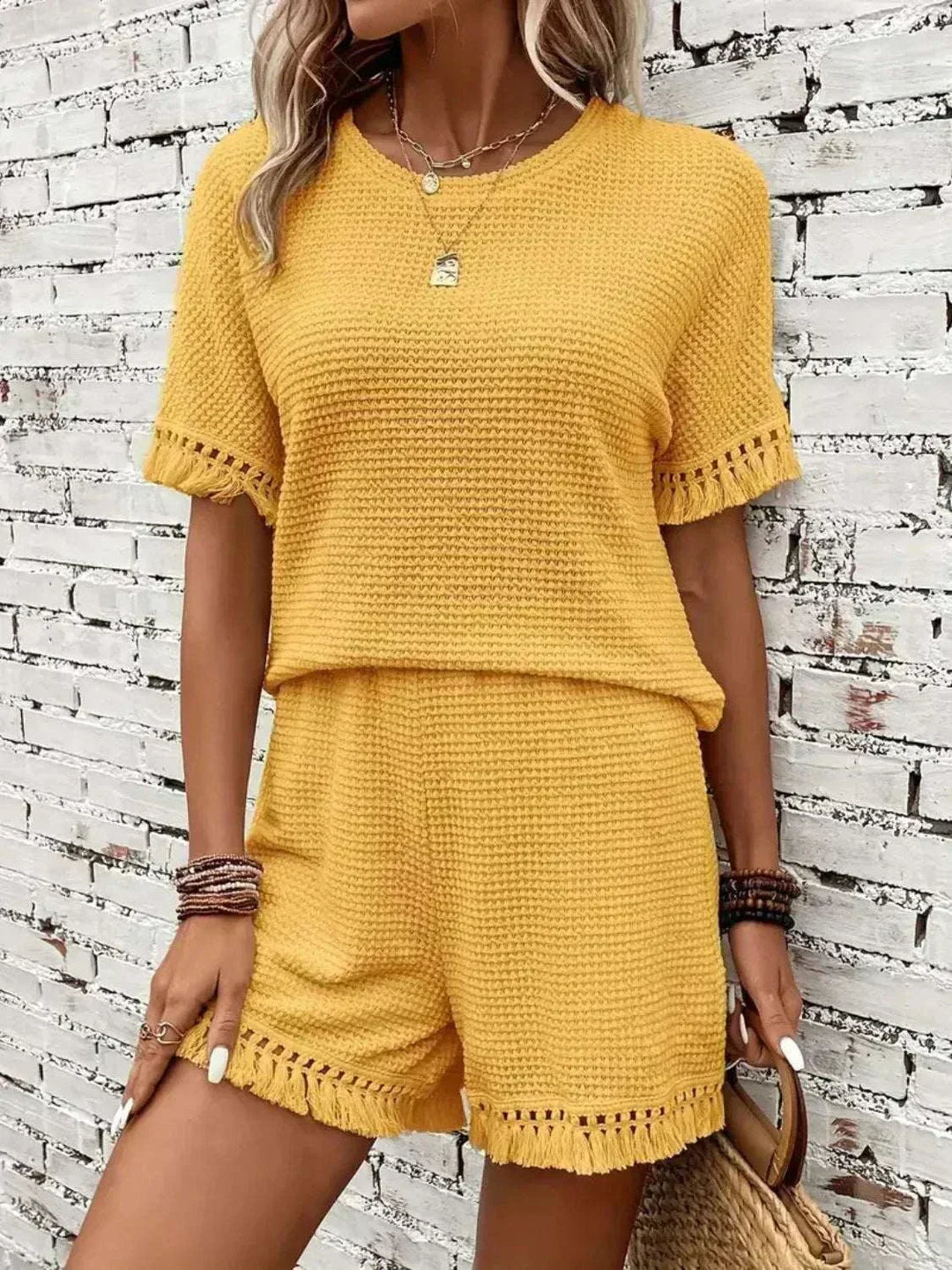 Women wearing a lightweight tassel top and matching shorts set for casual summer style