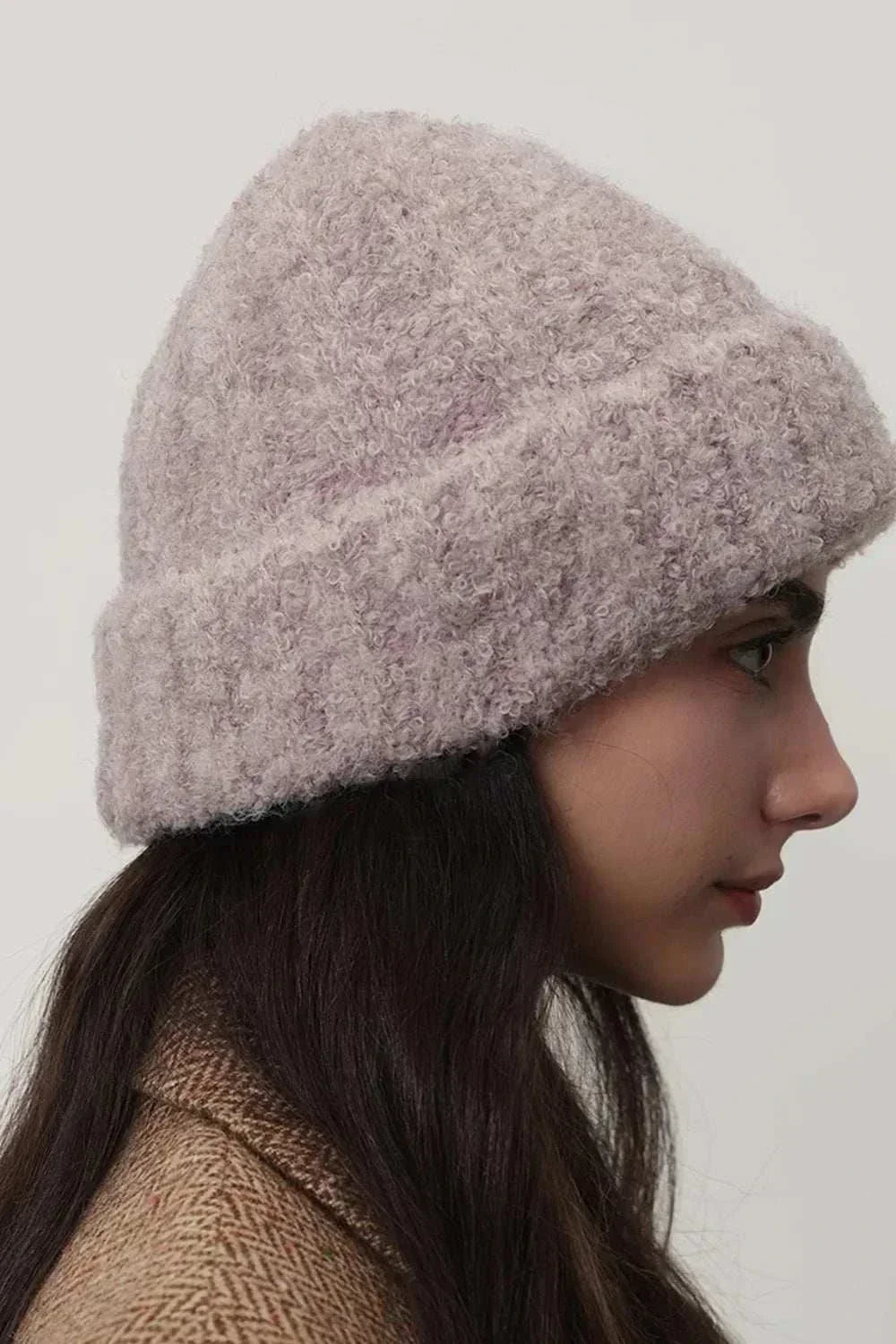 Women’s solid-color thermal knit winter hat from Hot Topic Goods with cozy fur material and versatile cold-weather design