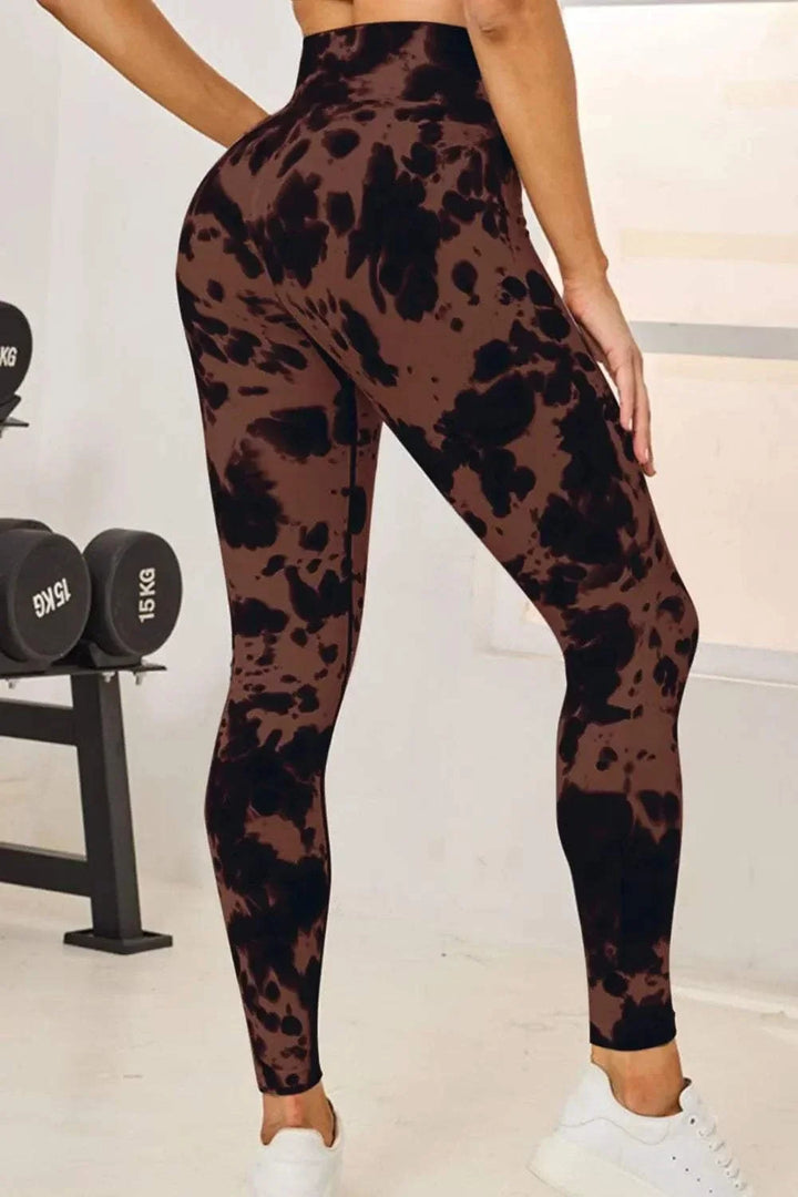 Women’s tie-dye active leggings with high-waist and fitted silhouette from Hot Topic Goods