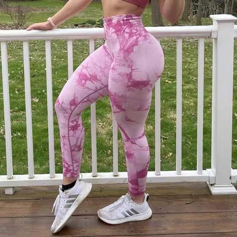 Women's tie-dye workout leggings with seamless, butt-lifting design from Hot Topic Goods