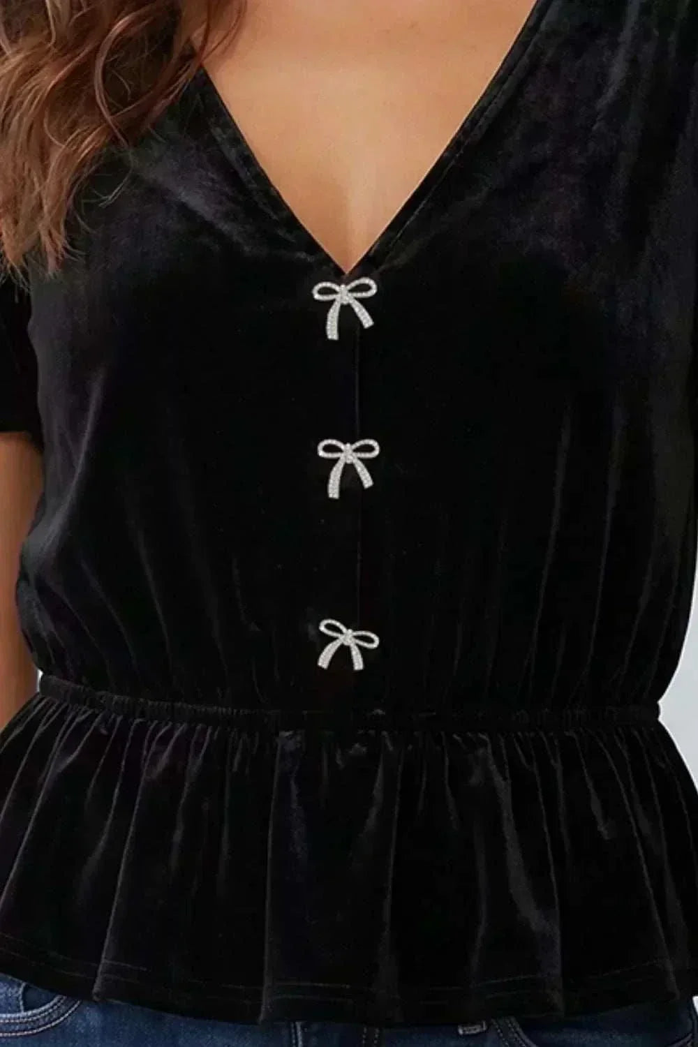 Women's V-neck bow peplum short sleeve blouse in soft breathable fabric with relaxed fit and decorative bow detail