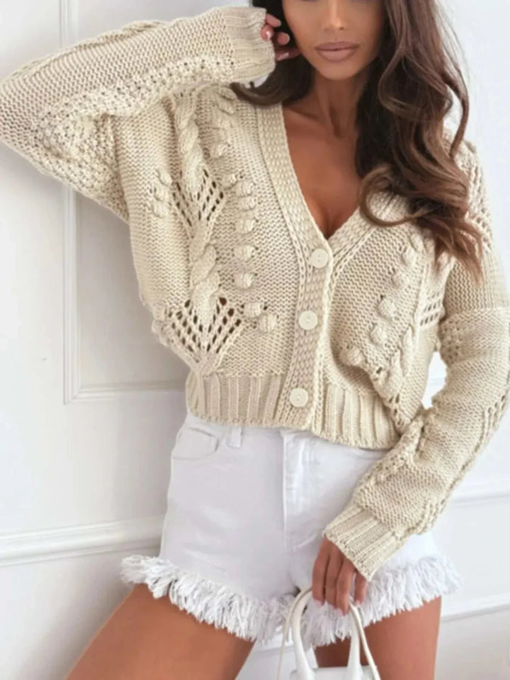 Woman wearing a Women’s V-Neck Button-Up Cardigan from Hot Topic Goods with long sleeves and button-up front