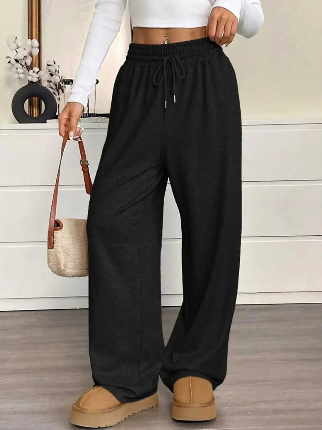 Women's high-waisted wide-leg drawstring pants in black for casual wear from Hot Topic Goods