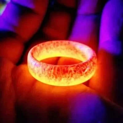 Unisex luminous ring glowing in the dark, innovative fashion accessory.