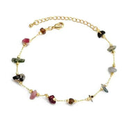 Colorful gemstone charm bracelet with adjustable gold chain.