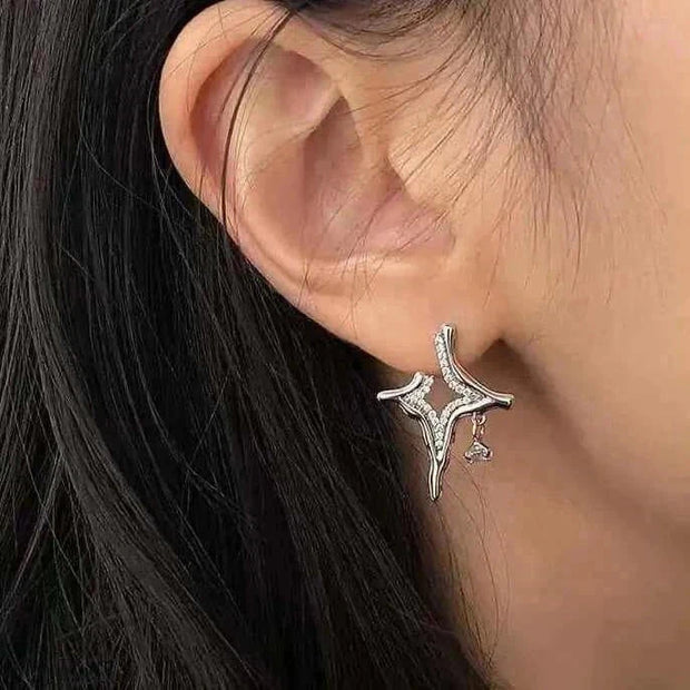 Elegant Asterism Rhinestone Earrings with metal geometry design displayed on ear.