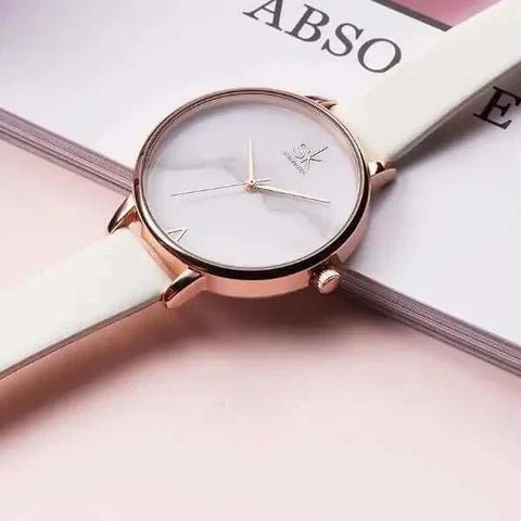 Shengke Fashion Watch with white band and rose gold case, elegant timepiece.
