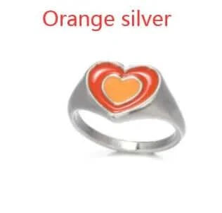Creative Love Heart Ring in orange and silver design.