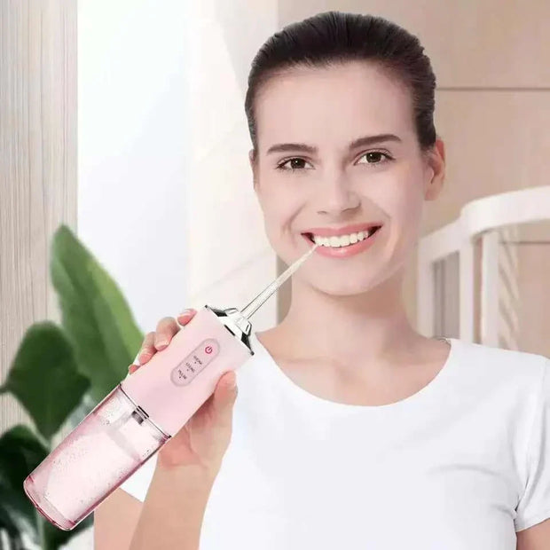Woman using the Waterproof Irrigator Dental Cleaner for superior oral care at home.