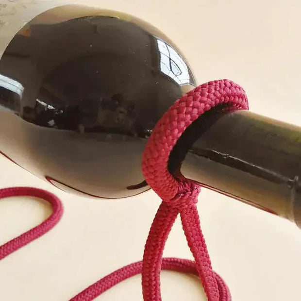 Suspended Rope Wine Bottle Holder with innovative design and durable rope securing a wine bottle.