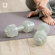 Fitness Water Barbell for home workouts, customizable resistance, ergonomic design on mat.
