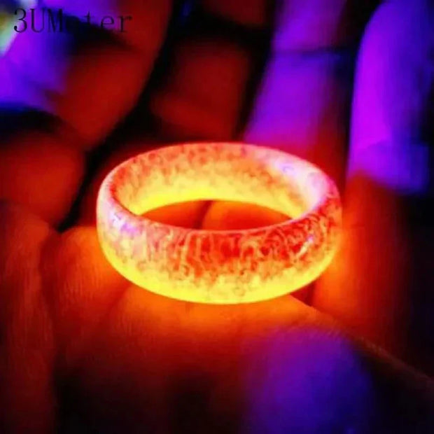 Unisex Luminous Ring glowing in the dark with vibrant colors.