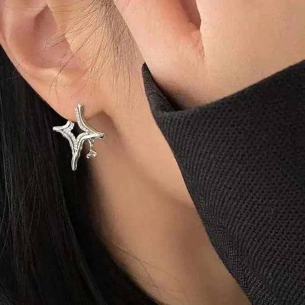 Elegant Asterism Rhinestone Earrings on ear, showcasing unique metal geometry and star-like sparkle.