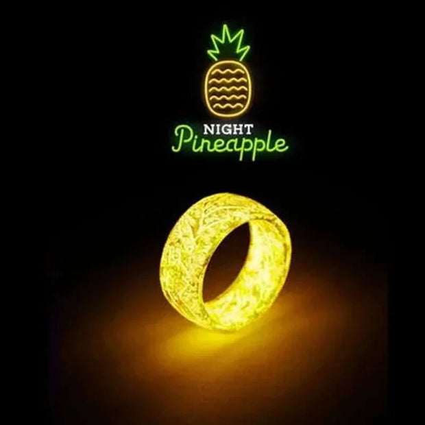 Unisex Luminous Ring glowing in the dark with "Night Pineapple" neon design.