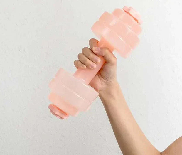 Fitness Water Barbell with adjustable water resistance held in hand.