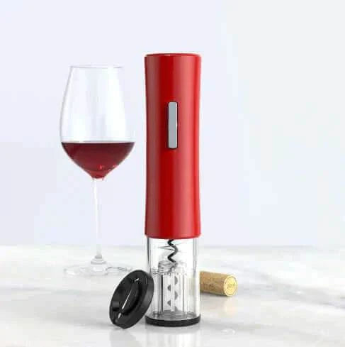 Automatic wine bottle opener with sleek red design, glass of wine, and cork in background.