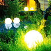 Waterproof Garden LED Lights Ball illuminating a lush outdoor garden space.