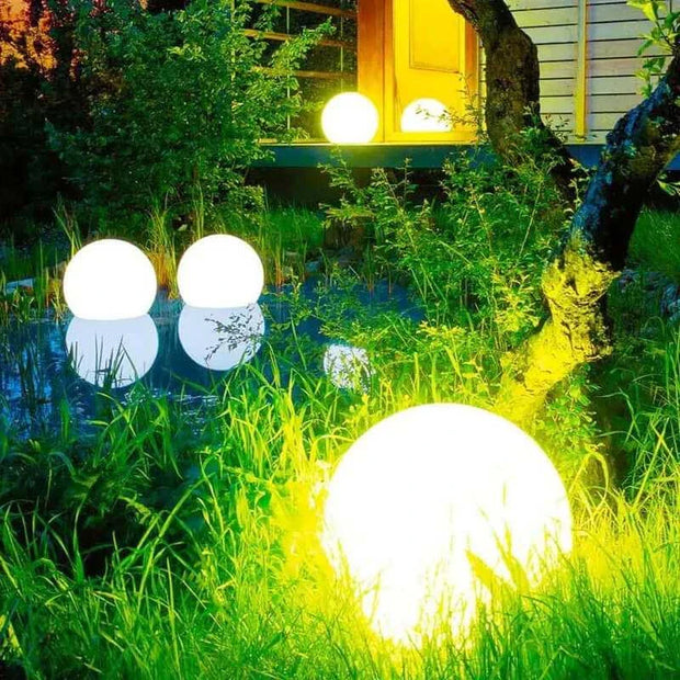 Waterproof Garden LED Lights Ball illuminating a lush outdoor garden space.