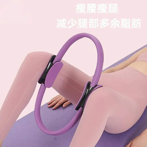 Purple Yoga Exercise Fitness Ring in use for a workout session on a yoga mat.