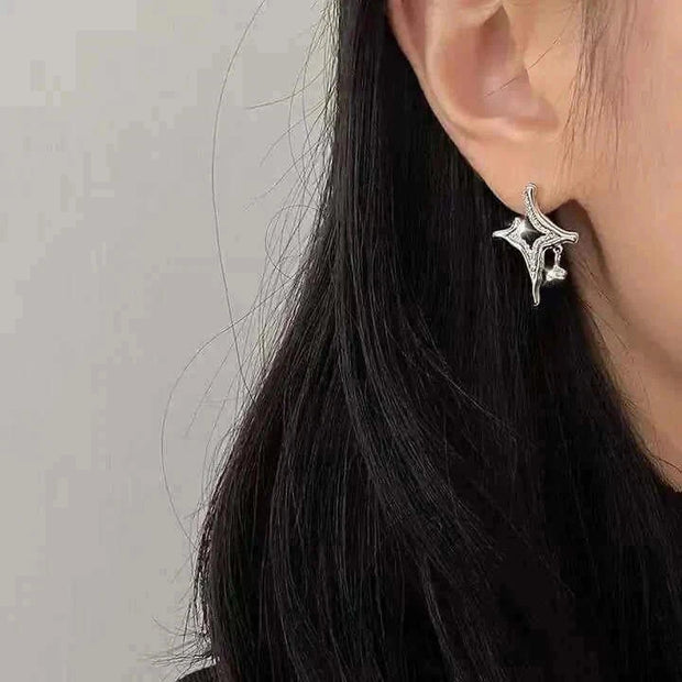 Asterism Rhinestone Earrings showcasing unique metal geometry design.