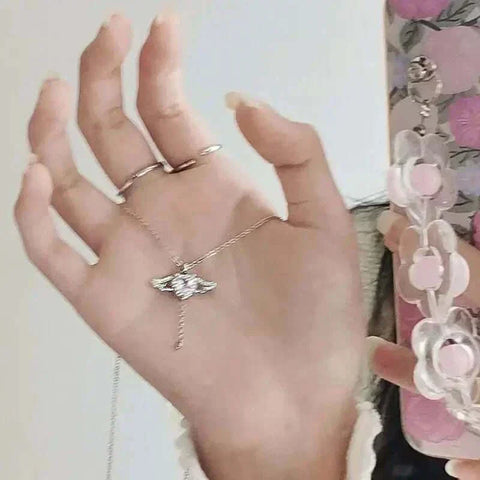 Heart Wings Necklace with delicate heart and wing design, symbolizing love and freedom.