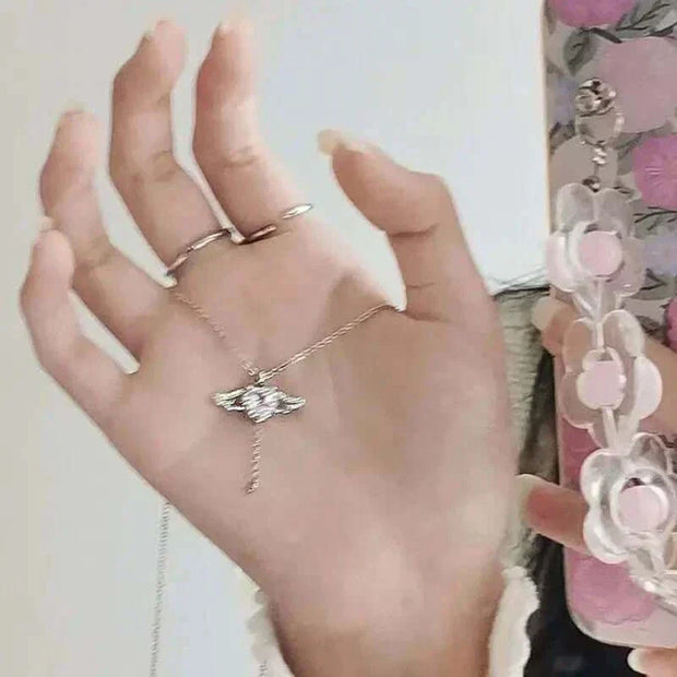 Heart Wings Necklace with delicate heart and wing design, symbolizing love and freedom.