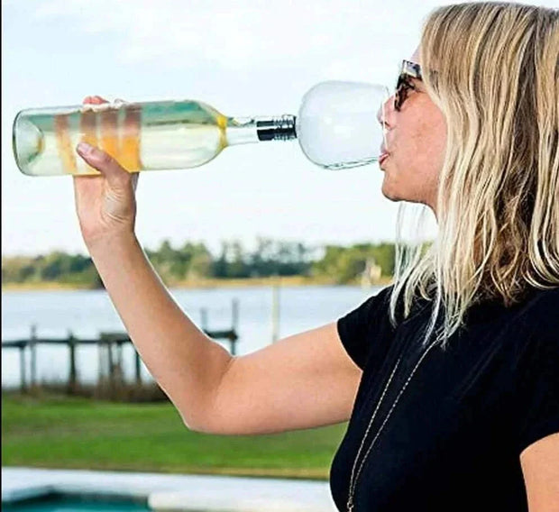 Woman using Creative Champagne Glass attachment on a wine bottle, outdoors.