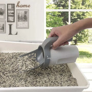 Cat Litter Shovel scooping clumps in a litter box.