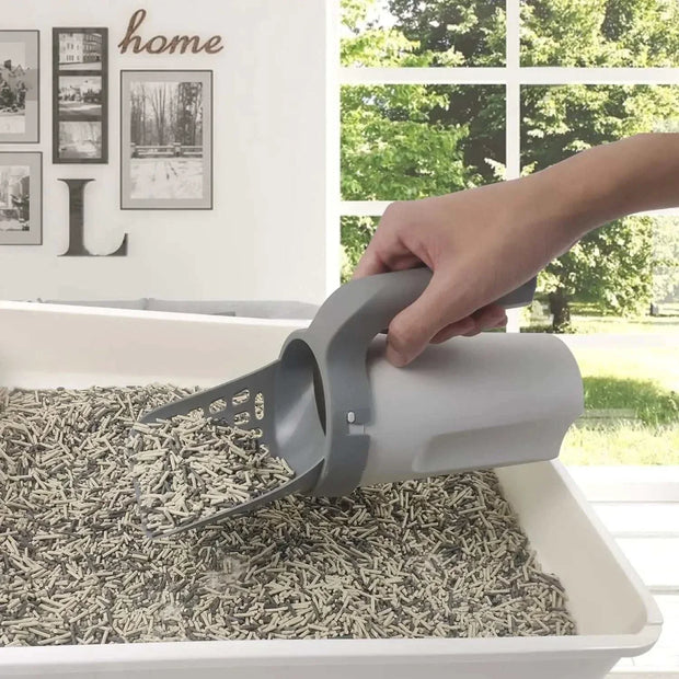 Cat Litter Shovel scooping clumps in a litter box.